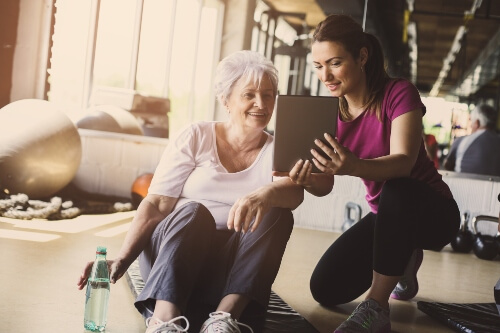 Exercise physiologist working with client