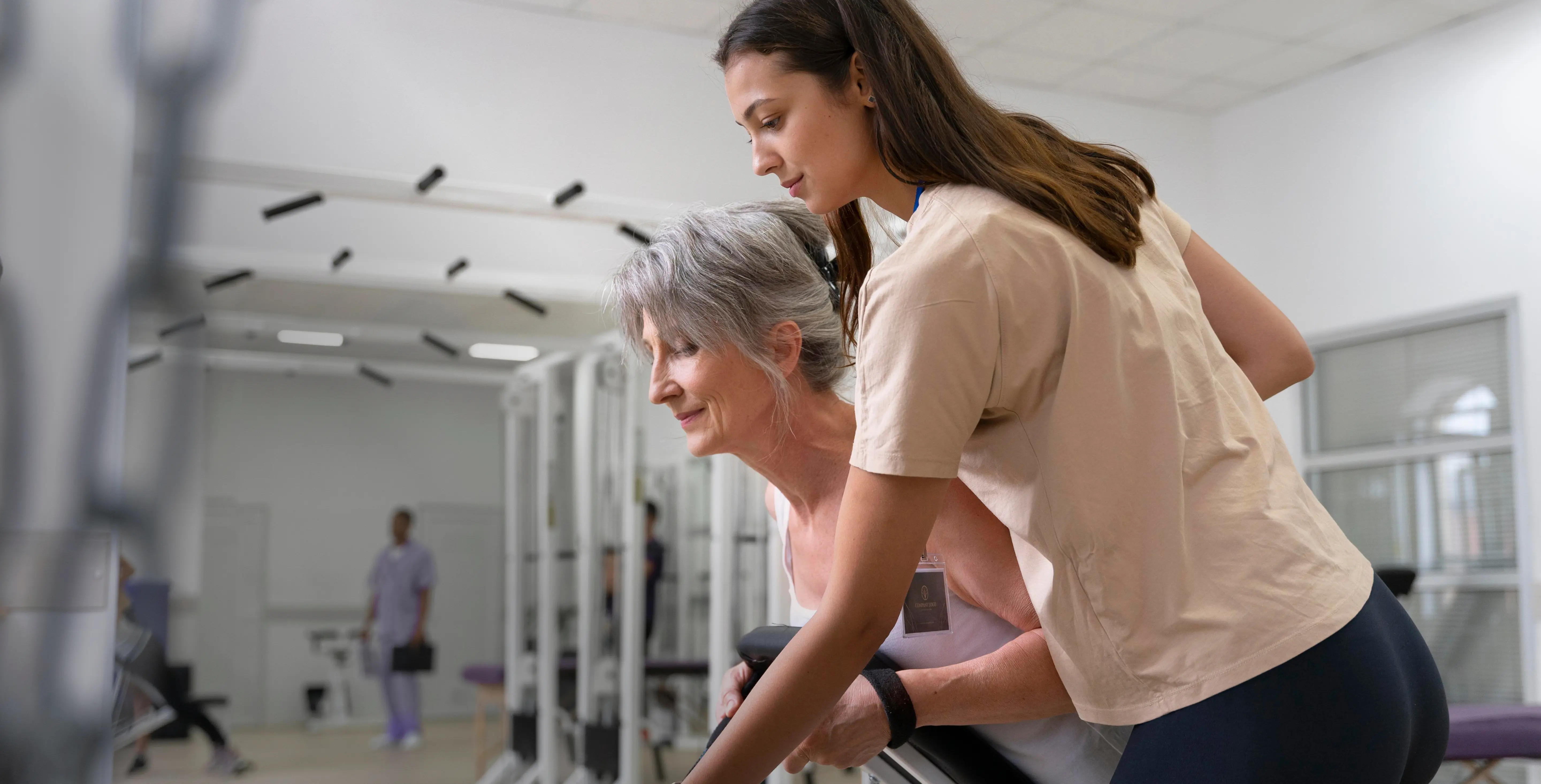 Exercise physiologist working with client