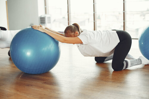 How to Correct Posture Exercises 3 Using an exercise ball for Spine decompression exercises. Sydney Sports and Exercise Physiology